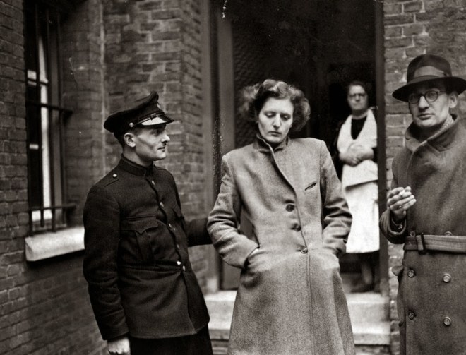 A French woman has her head shaved by civilians as a penalty for having consorted with German troops, 1944 4