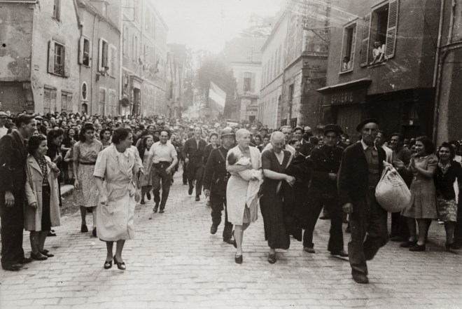 A French woman has her head shaved by civilians as a penalty for having consorted with German troops, 1944 5