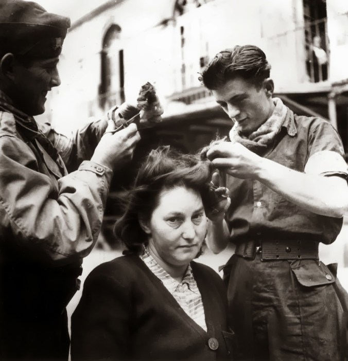 A French woman has her head shaved by civilians as a penalty for having consorted with German troops, 1944 6